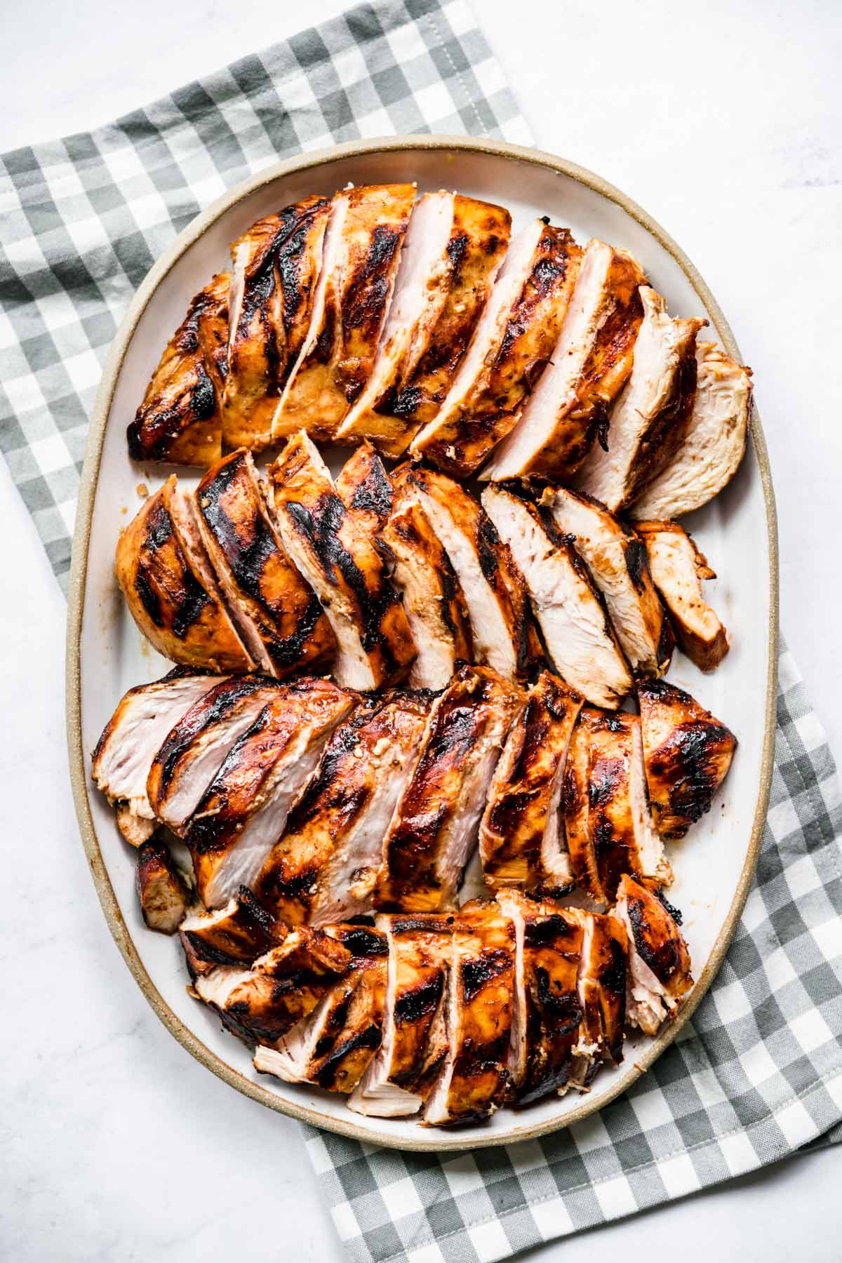 Grilled Chicken Marinade cooked chicken sliced on plate