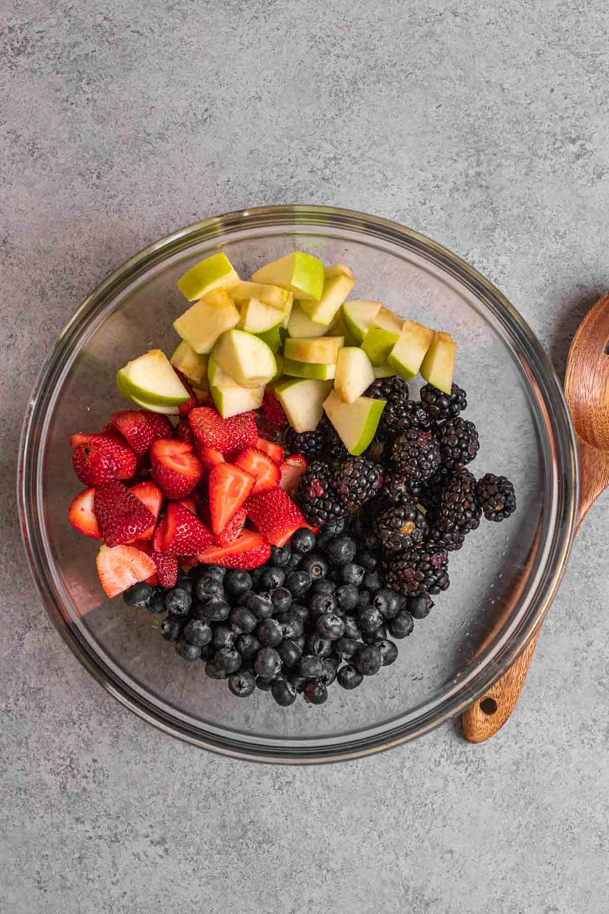 Fruit in mixing bowl for Honey Lime Berry Fruit Salad