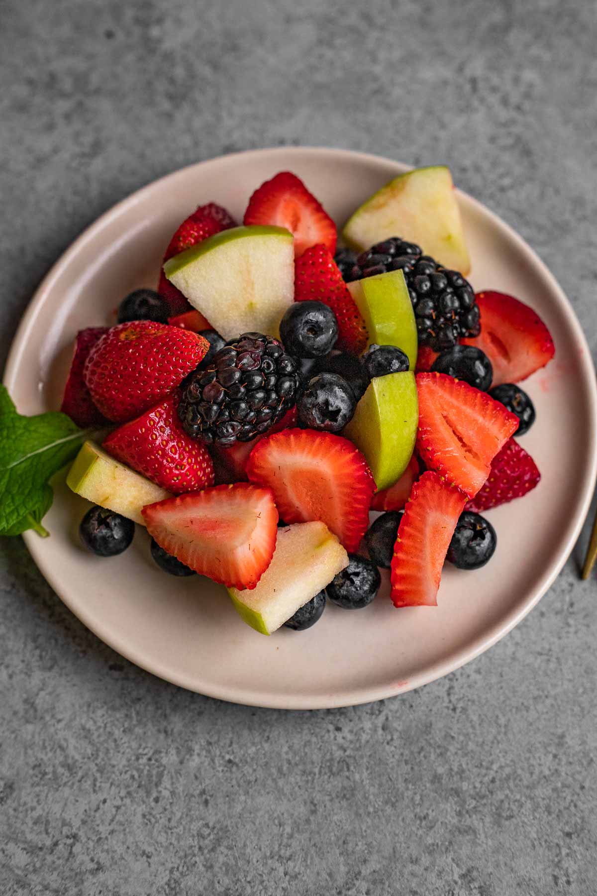 Honey Lime Berry Fruit Salad on plate