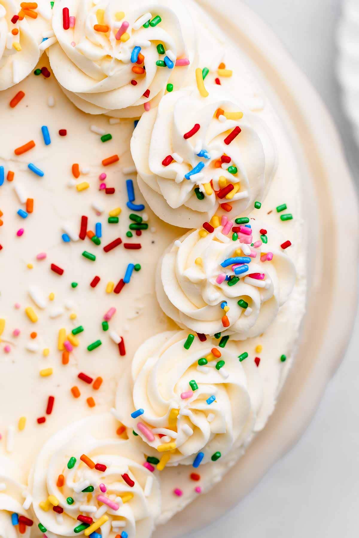 Ice Cream Cake with white frosting and sprinkles