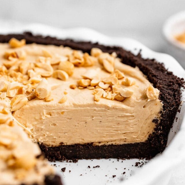 Oreo Peanut Butter Whip Pie in pie dish with slice removed