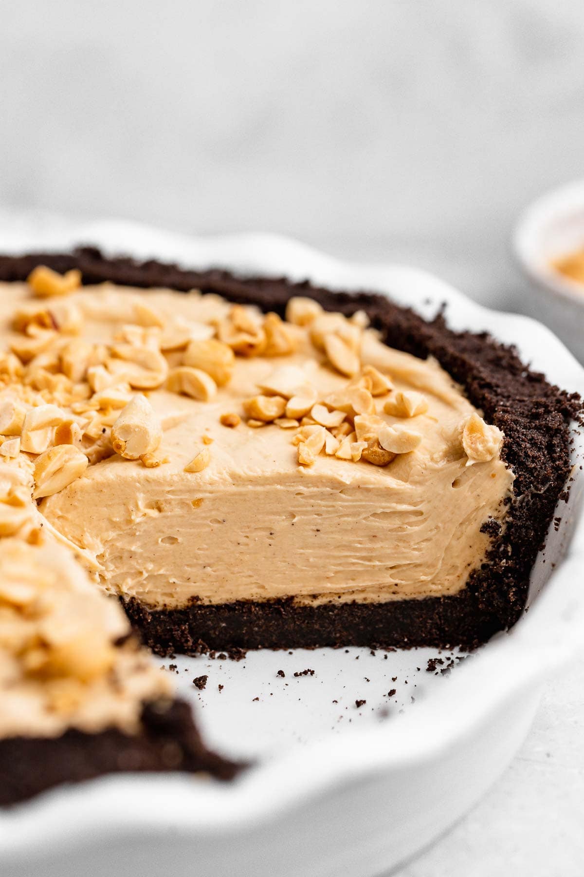 Oreo Peanut Butter Whip Pie in pie dish with slice removed