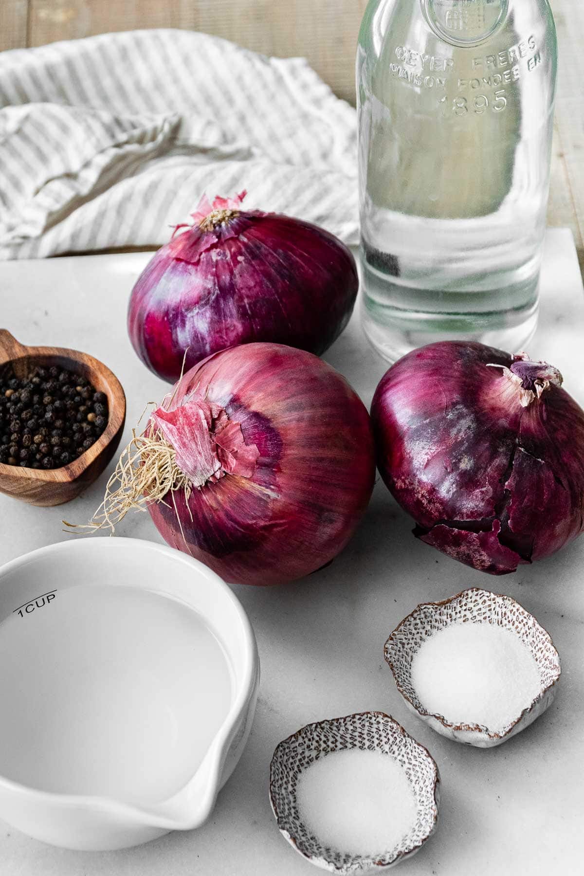 Ingredients for Pickled Red Onions in prep bowls