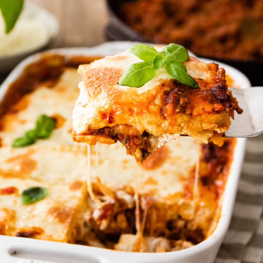 Ravioli Lasagna Bake in baking dish with serving spatula