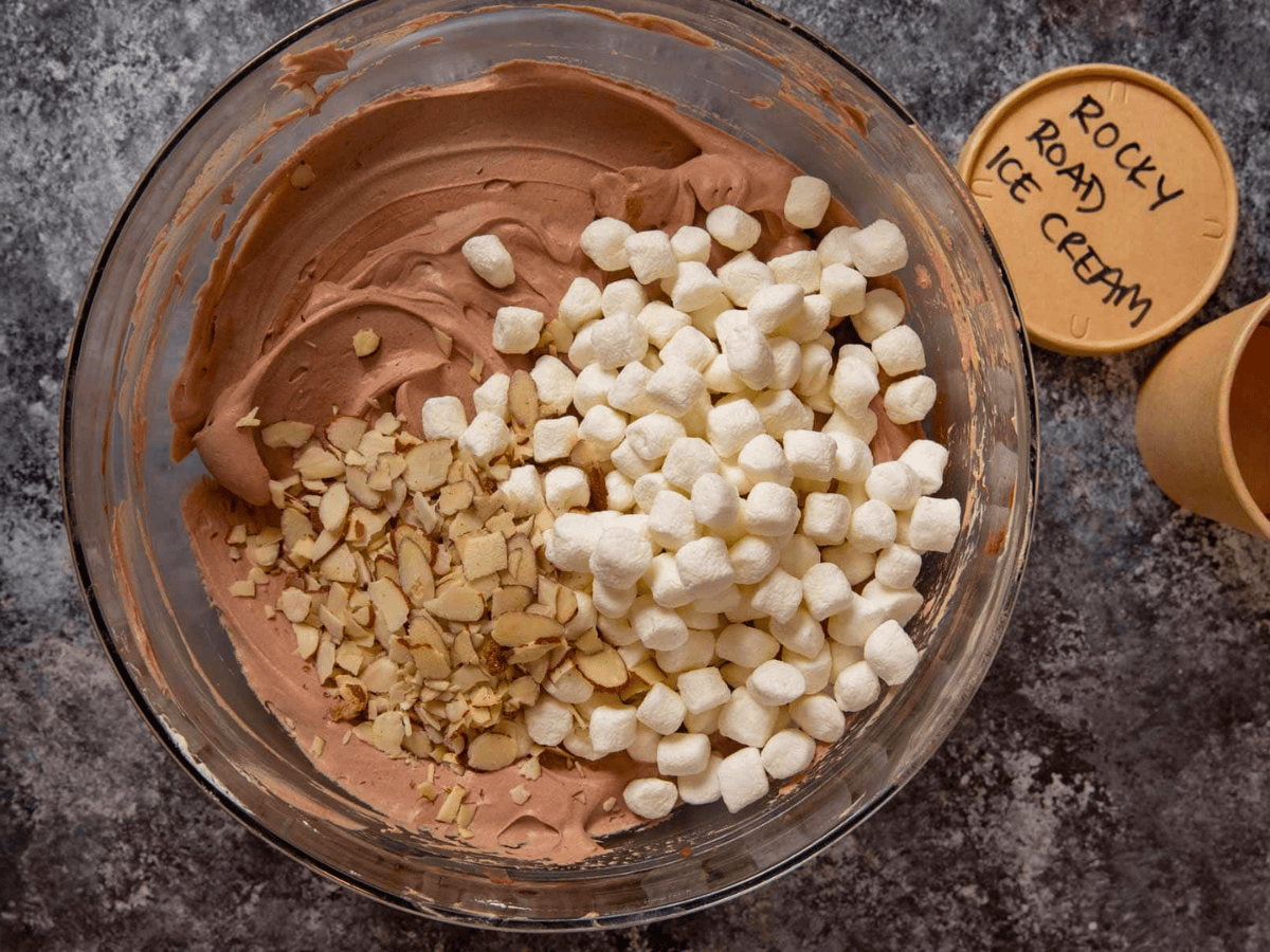 chocolate custard, marshmallows, and almonds in a glass bowl