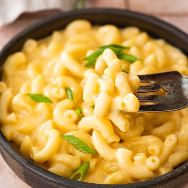 Skillet Creamy Mac and Cheese in bowl with fork