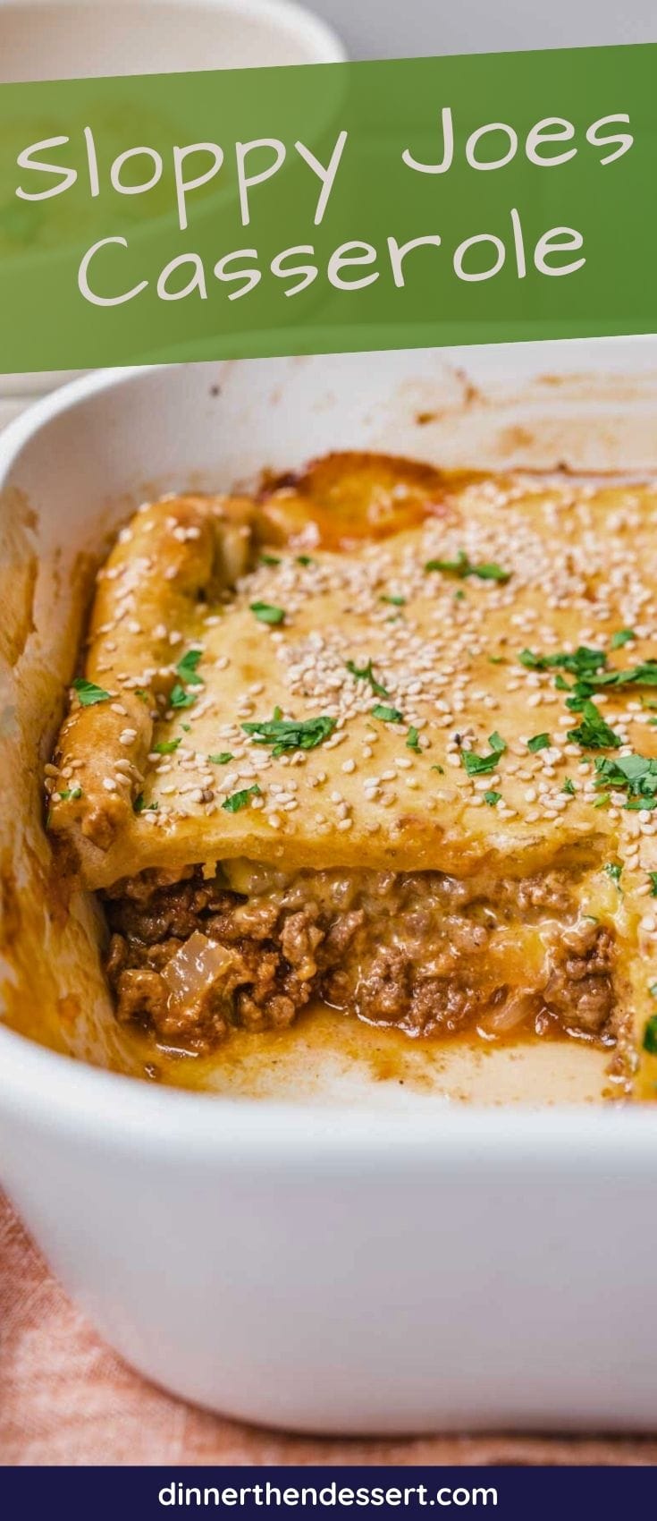 Easy Sloppy Joe Casserole is a quick family-friendly dinner! Baked sesame seed bun topping with a cheesy ground beef filling from scratch! Side view of baked casserole in pan with slice removed