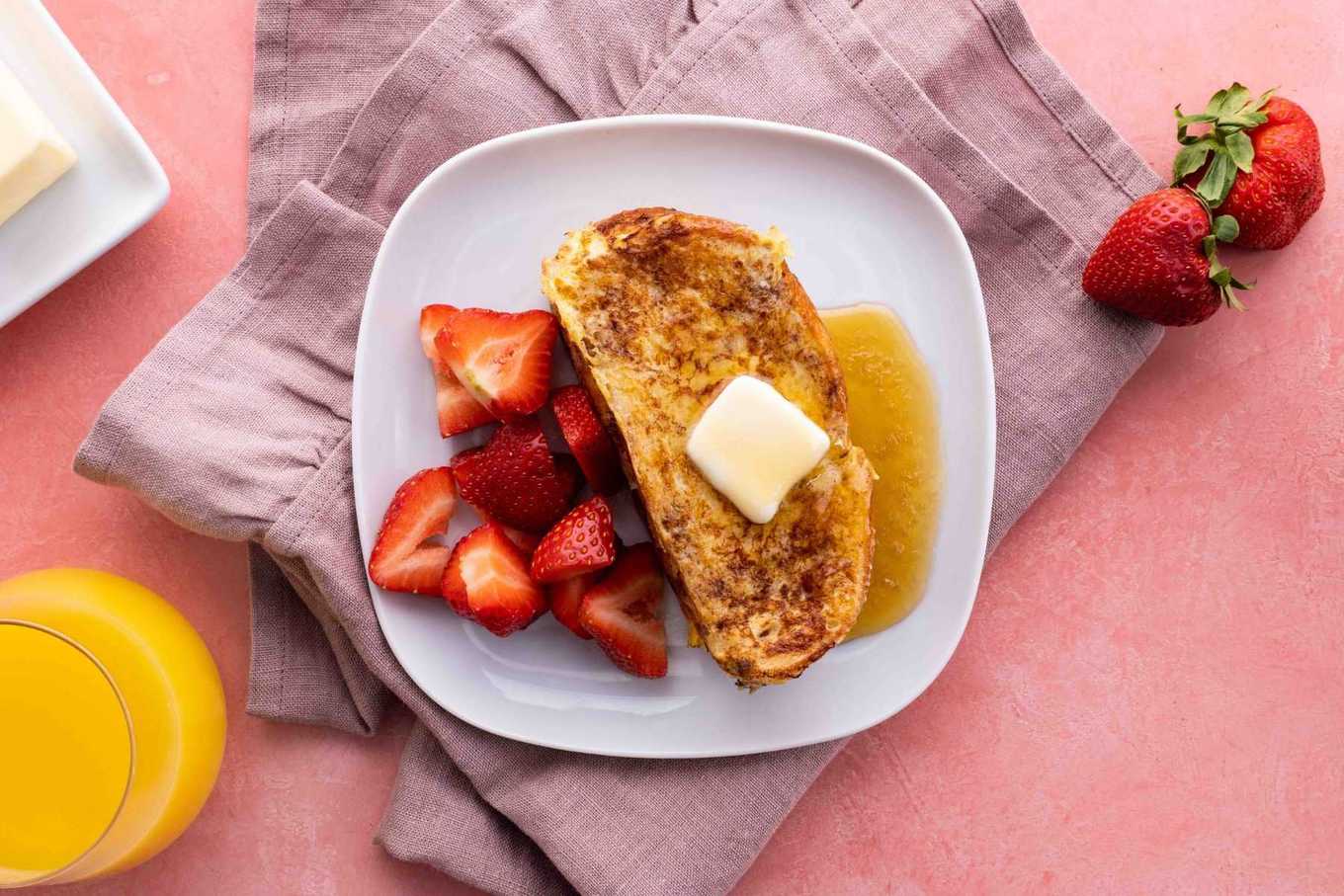 Stuffed French Toast on plate with butter and syrup