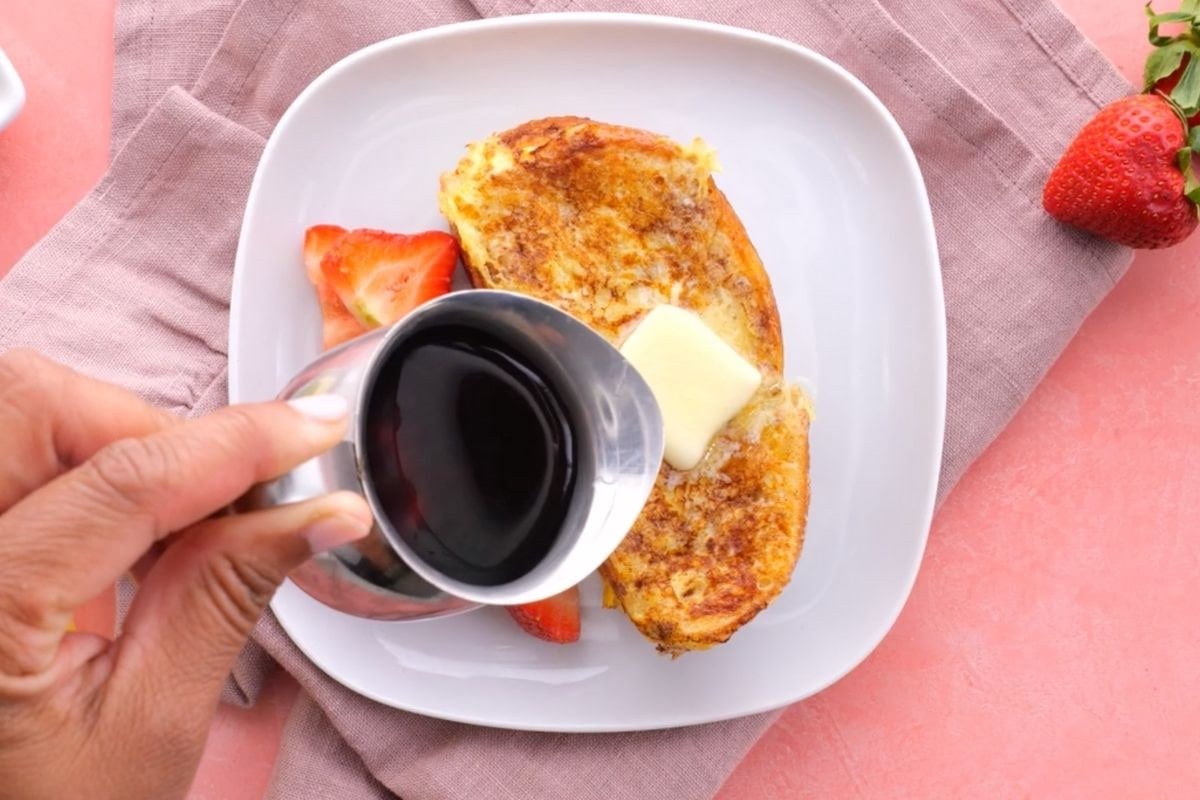 Stuffed French Toast on plate with butter and syrup