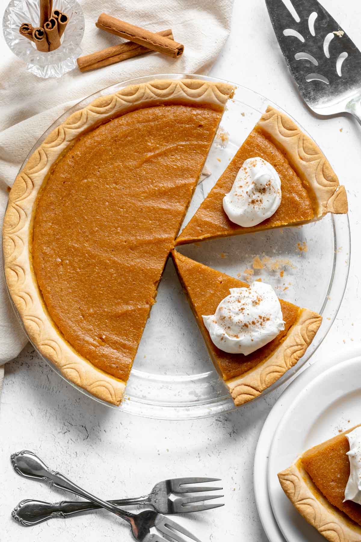 Sweet Potato Pie sliced with whipped cream