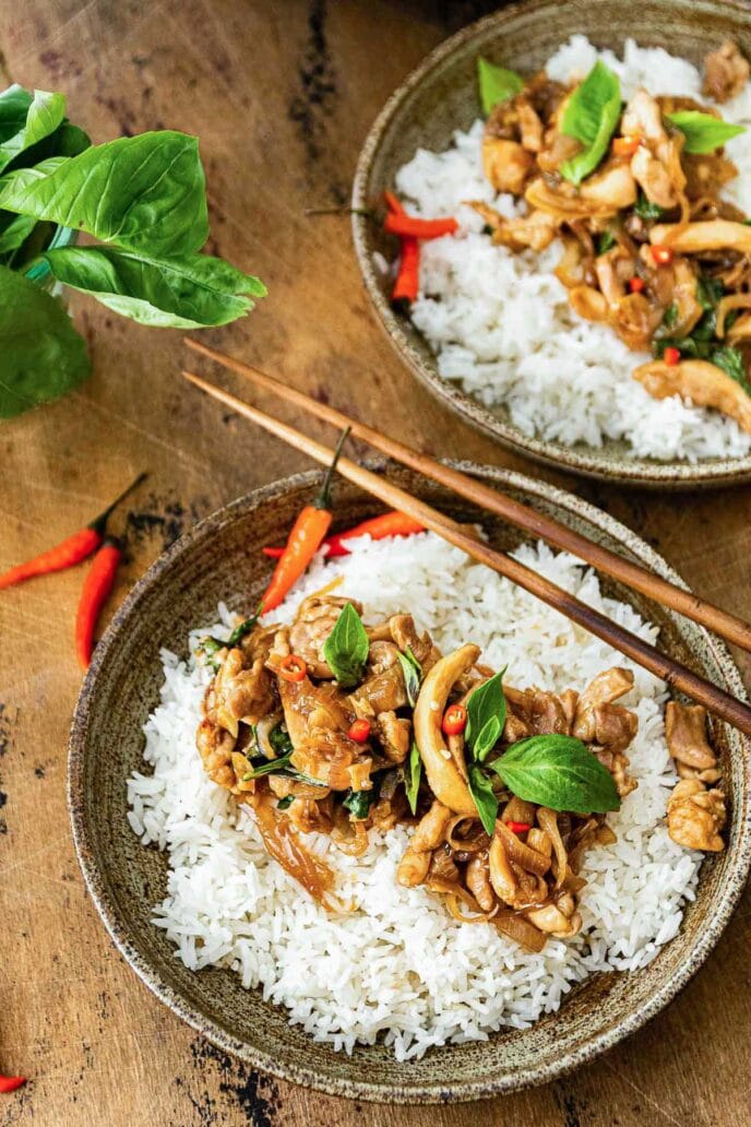 Thai Basil Chicken over rice on a plate