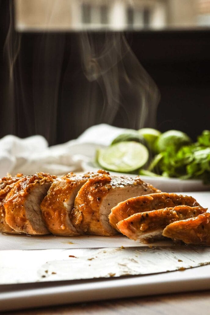 Thai Peanut Pork Tenderloin sliced on cutting board