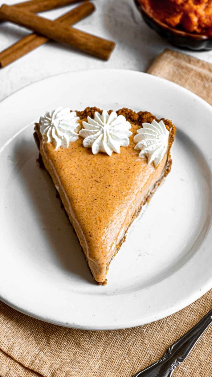 Frozen Pumpkin Ice Cream Pie slice on plate