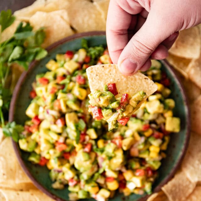 Avocado Salsa in serving bowl with tortilla chips