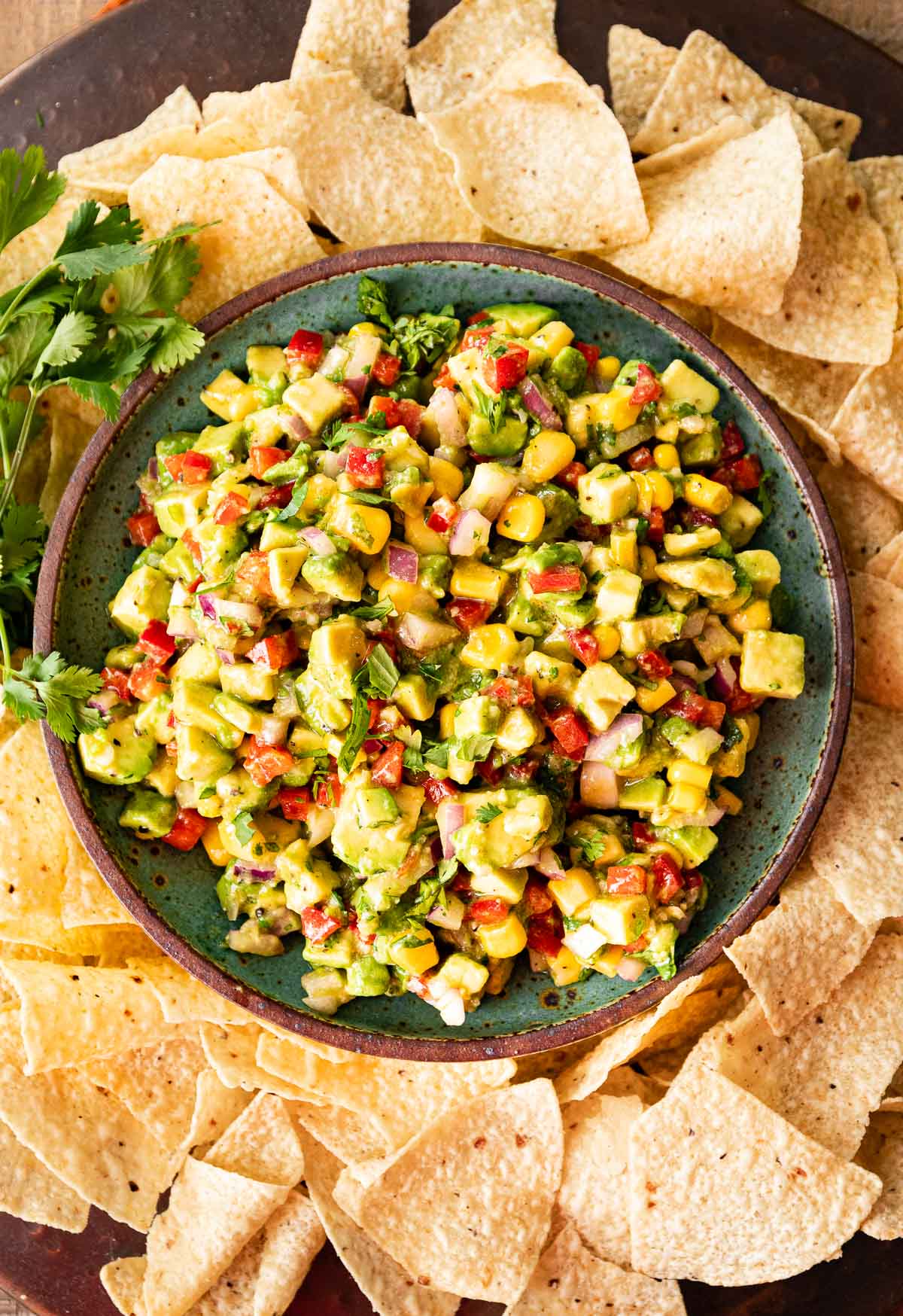 Avocado Salsa in serving bowl with tortilla chips