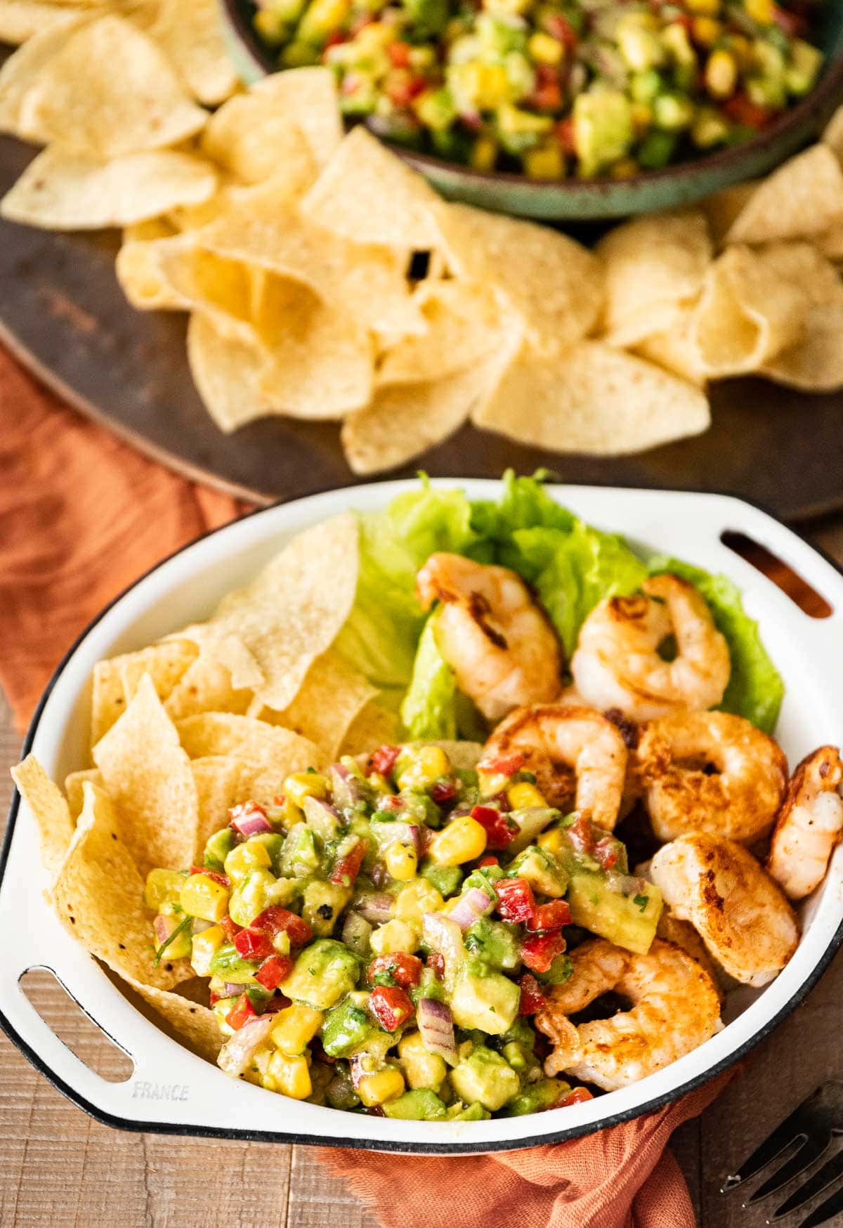 Avocado Salsa served with tortilla chips, lettuce and grilled shrimp