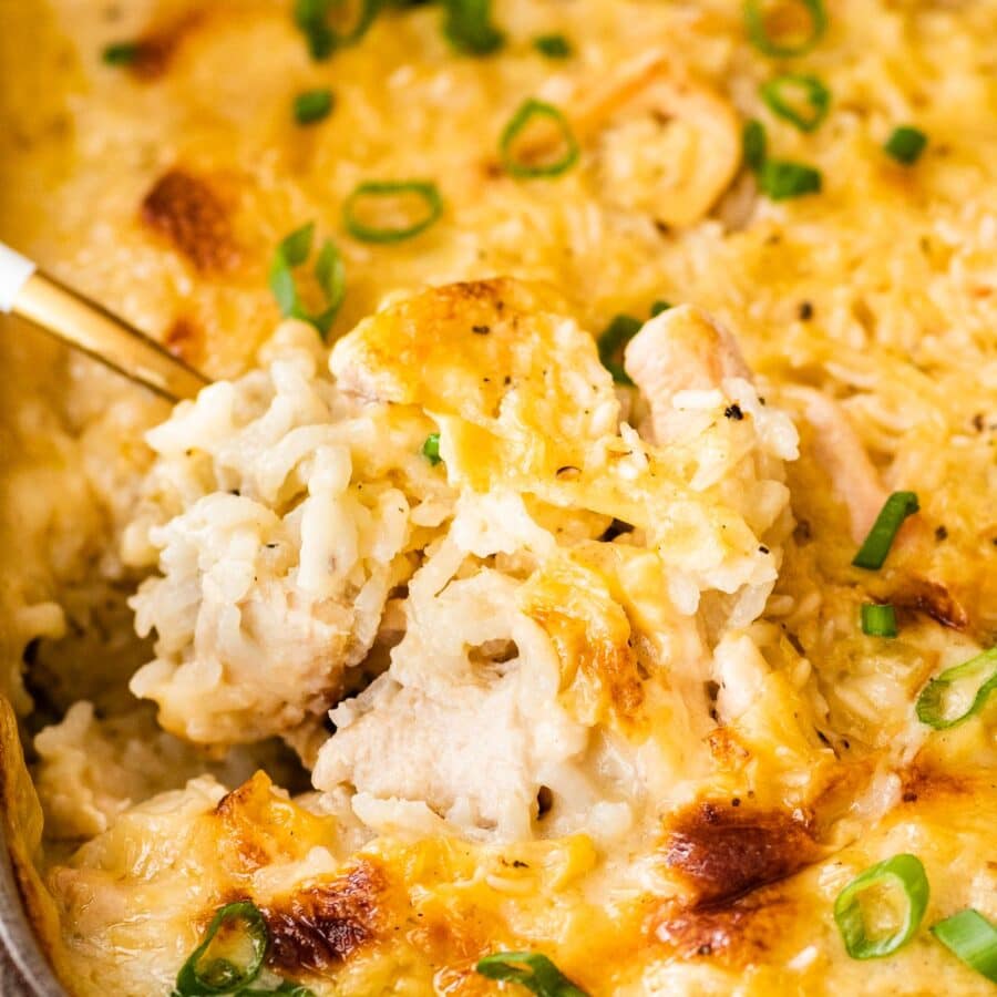 Chicken and Rice Casserole in baking dish after baking with serving spoon