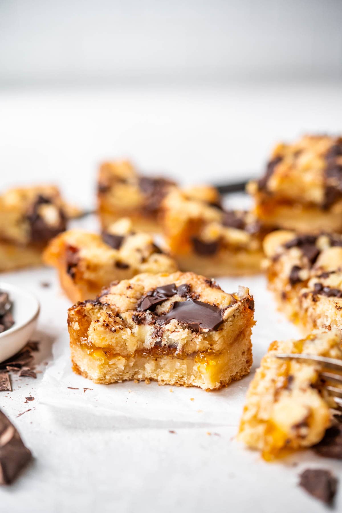 Sliced Dark Chocolate Orange Shortbread Bars on parchment