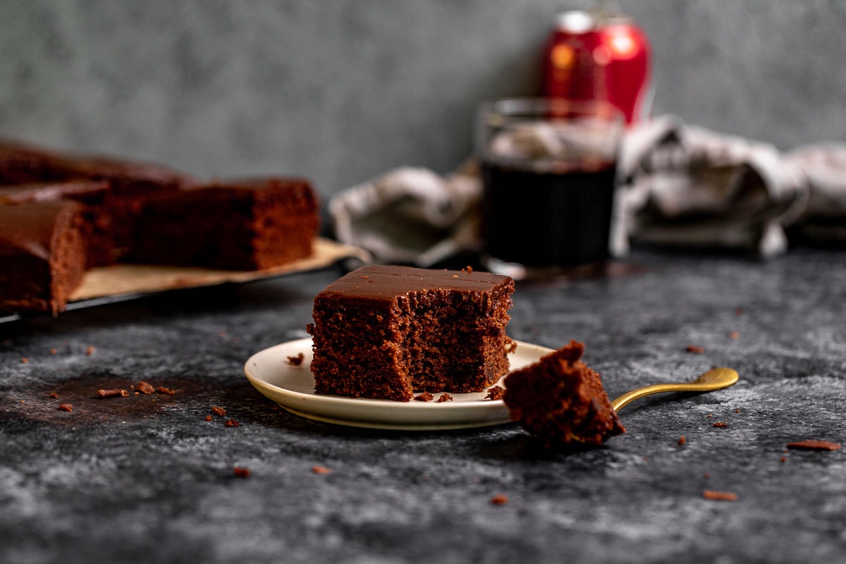 Coca Cola Sheet Cake slice on plate with fork