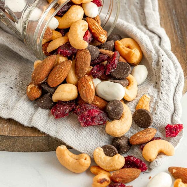 Cranberry Trail Mix spilling out of glass jar