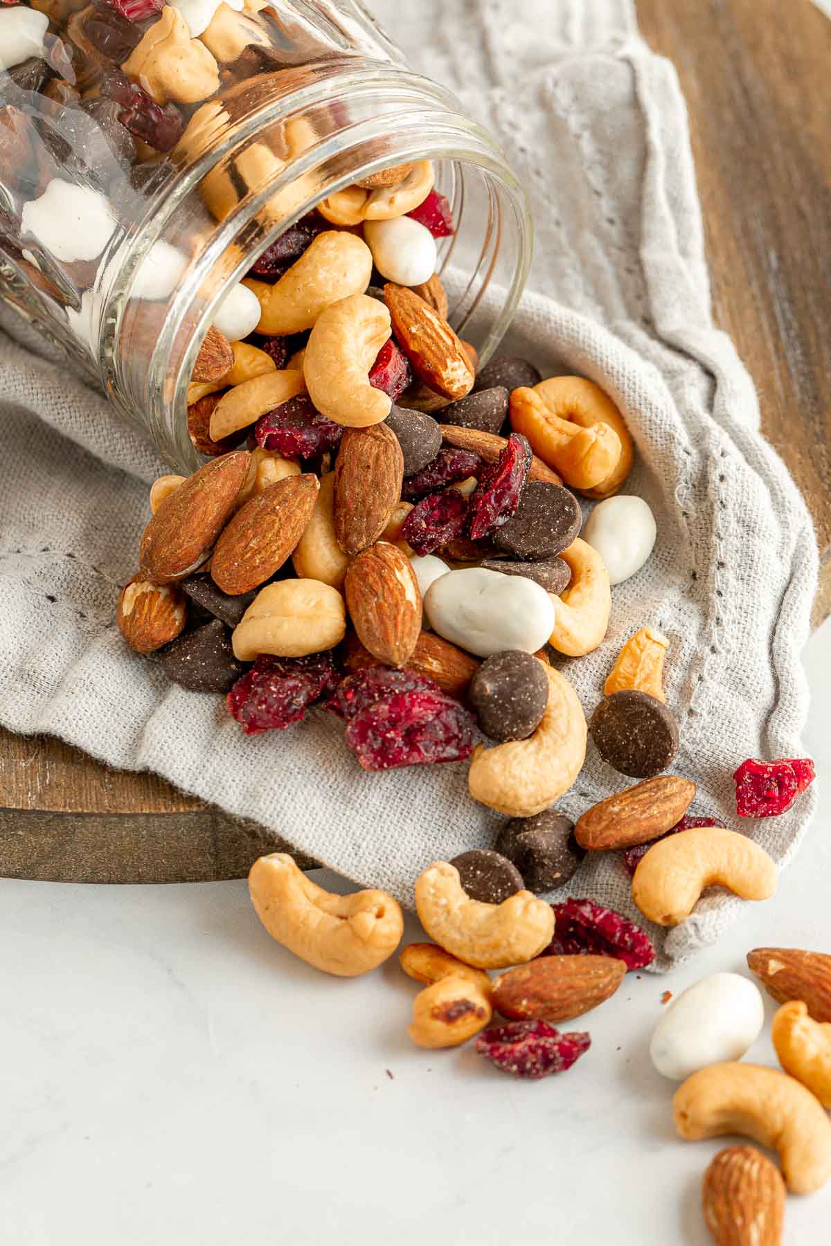 Cranberry Trail Mix spilling out of glass jar