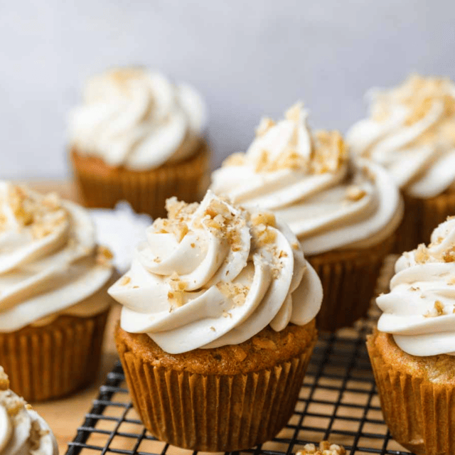 Cupcakes frosted on wire rack
