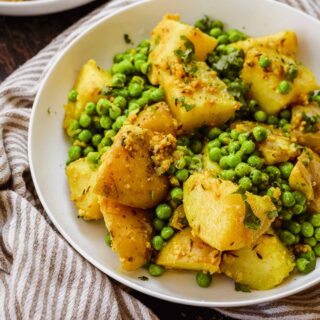 Indian Bombay Potatoes and Peas in serving bowl