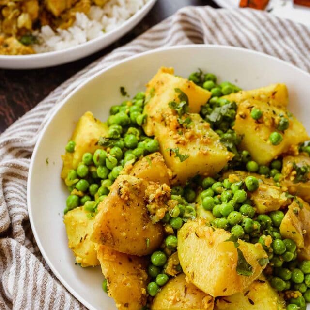 Indian Bombay Potatoes and Peas in serving bowl