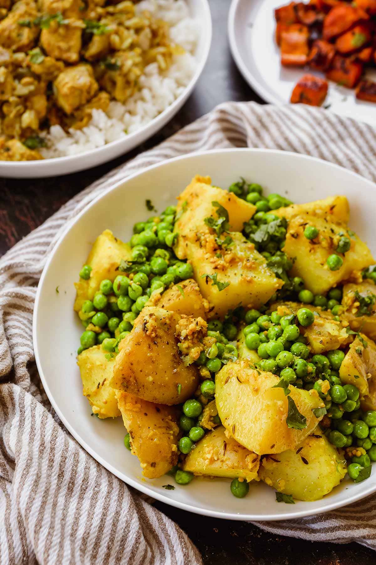 Indian Bombay Potatoes and Peas in serving bowl