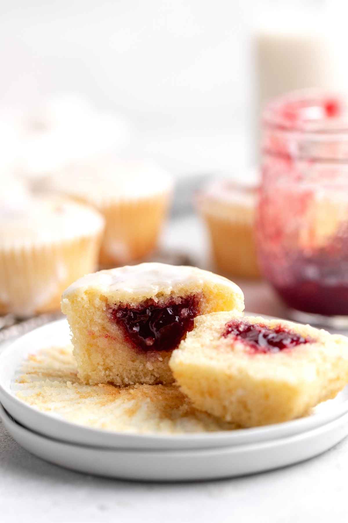 Jelly Doughnut Muffins on plate cut in half