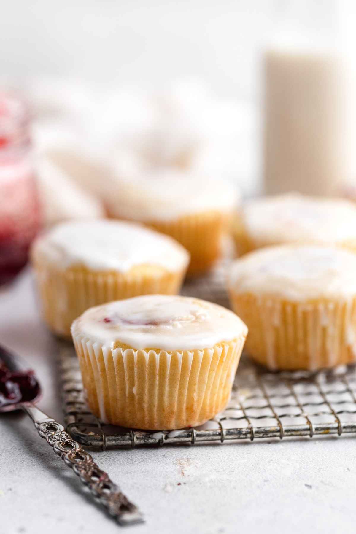 Jelly Doughnut Muffins on wire rack with glaze