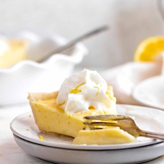 Lemon Chiffon Pie slice on plate with fork