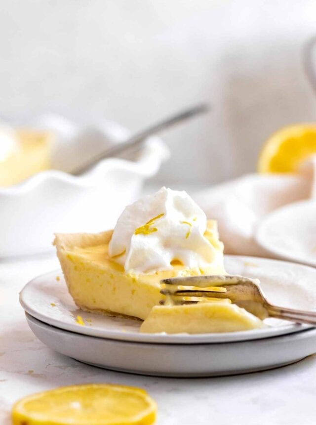 Lemon Chiffon Pie slice on plate with fork