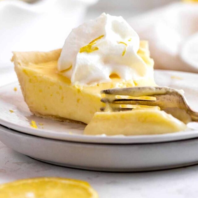 Lemon pie on plate with whipped cream