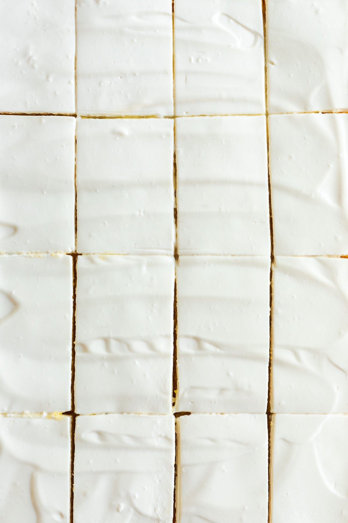 Lemon Shortbread Bars Sliced on board