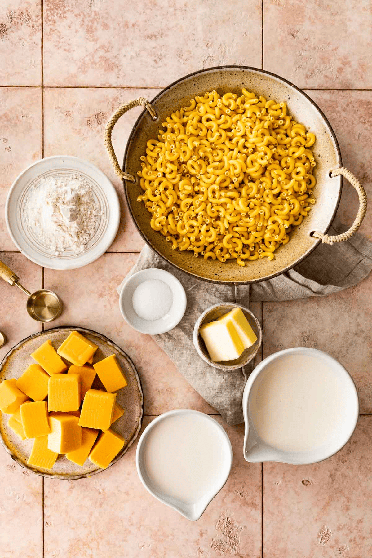 Macaroni and cheese ingredients separated in bowls