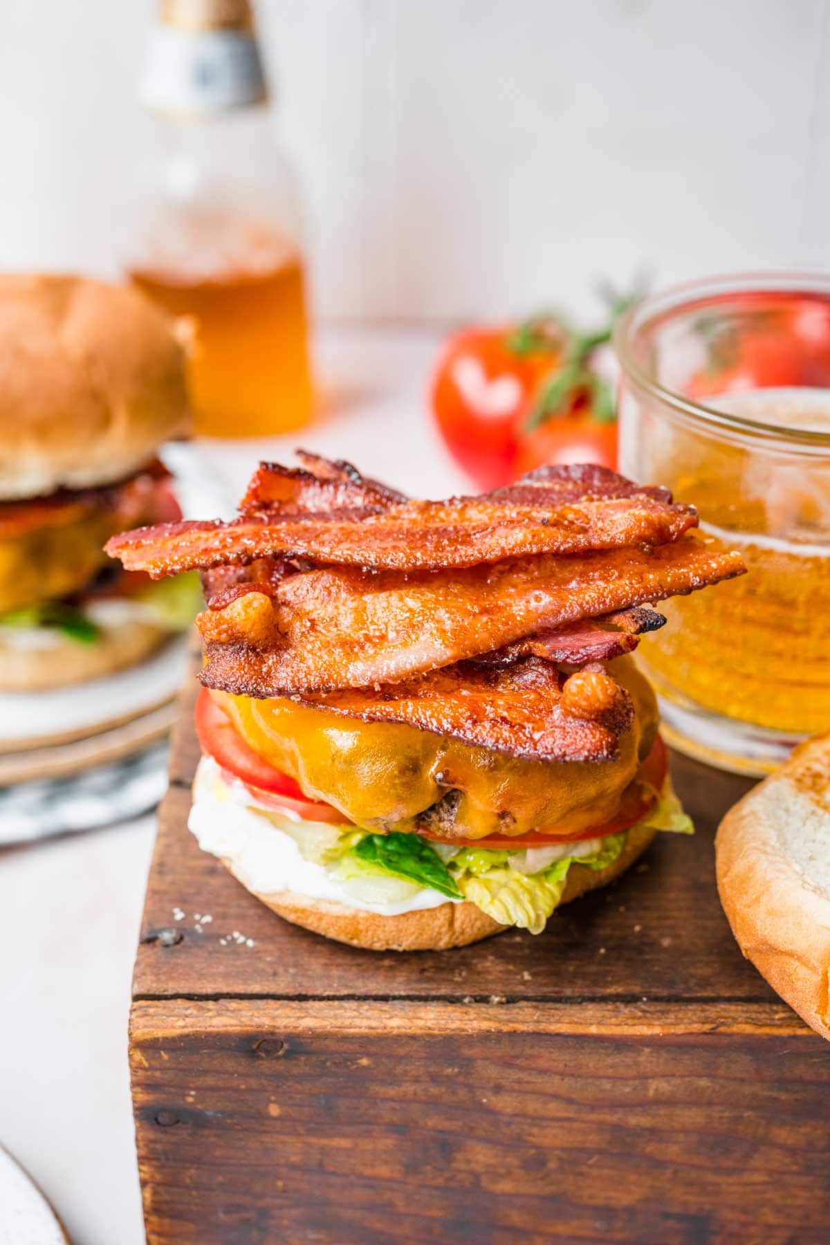 Bacon Bacon Burgers on serving platter with bacon topping