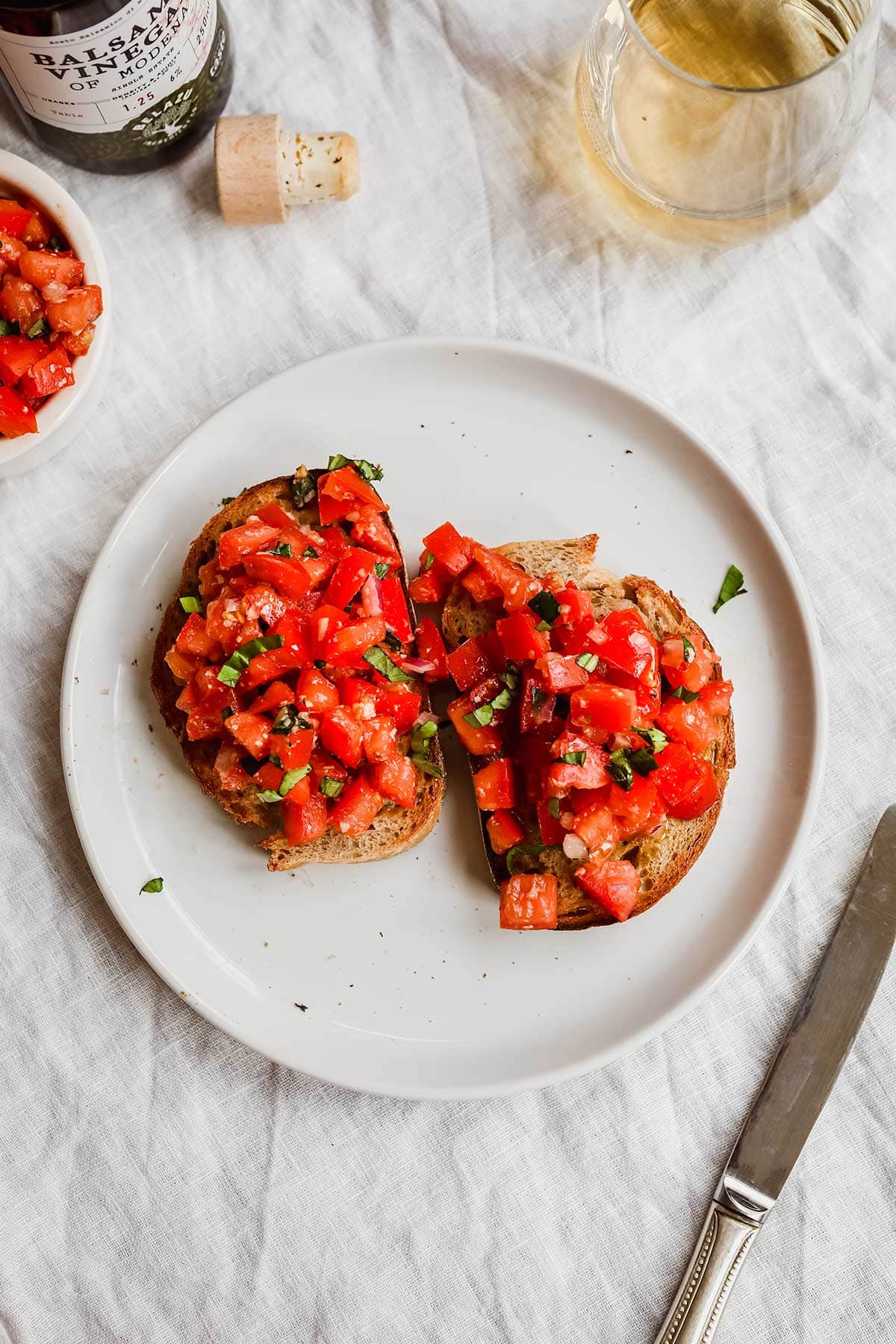 Balsamic Bruschetta tomato mixture on toasted bread on plate