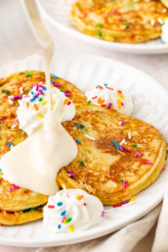 Birthday Cake Pancakes on plate with vanilla glaze