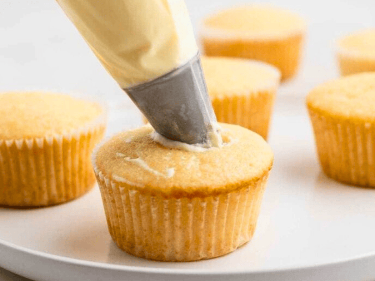 filling cupcake with piping bag