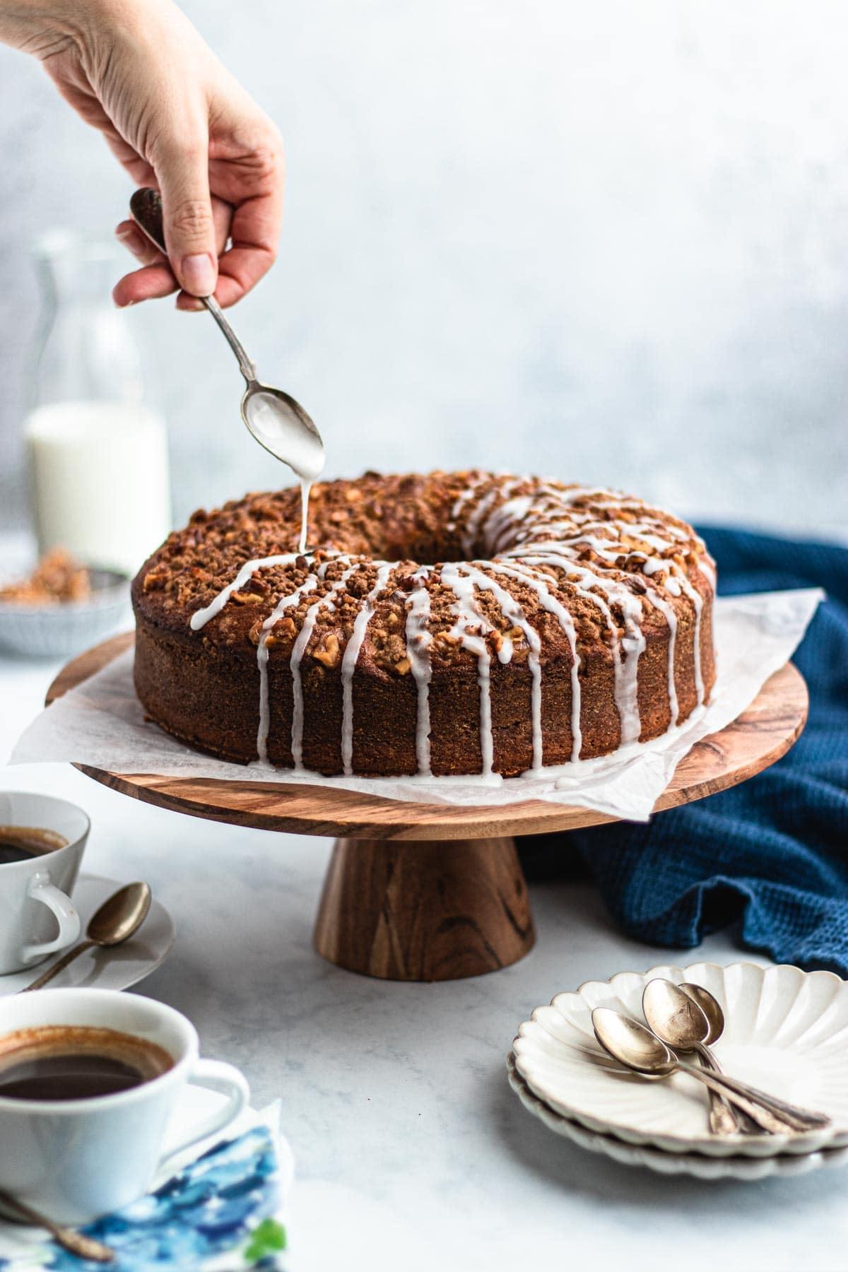 Bundt Coffee Cake on serving stand with icing drizzle