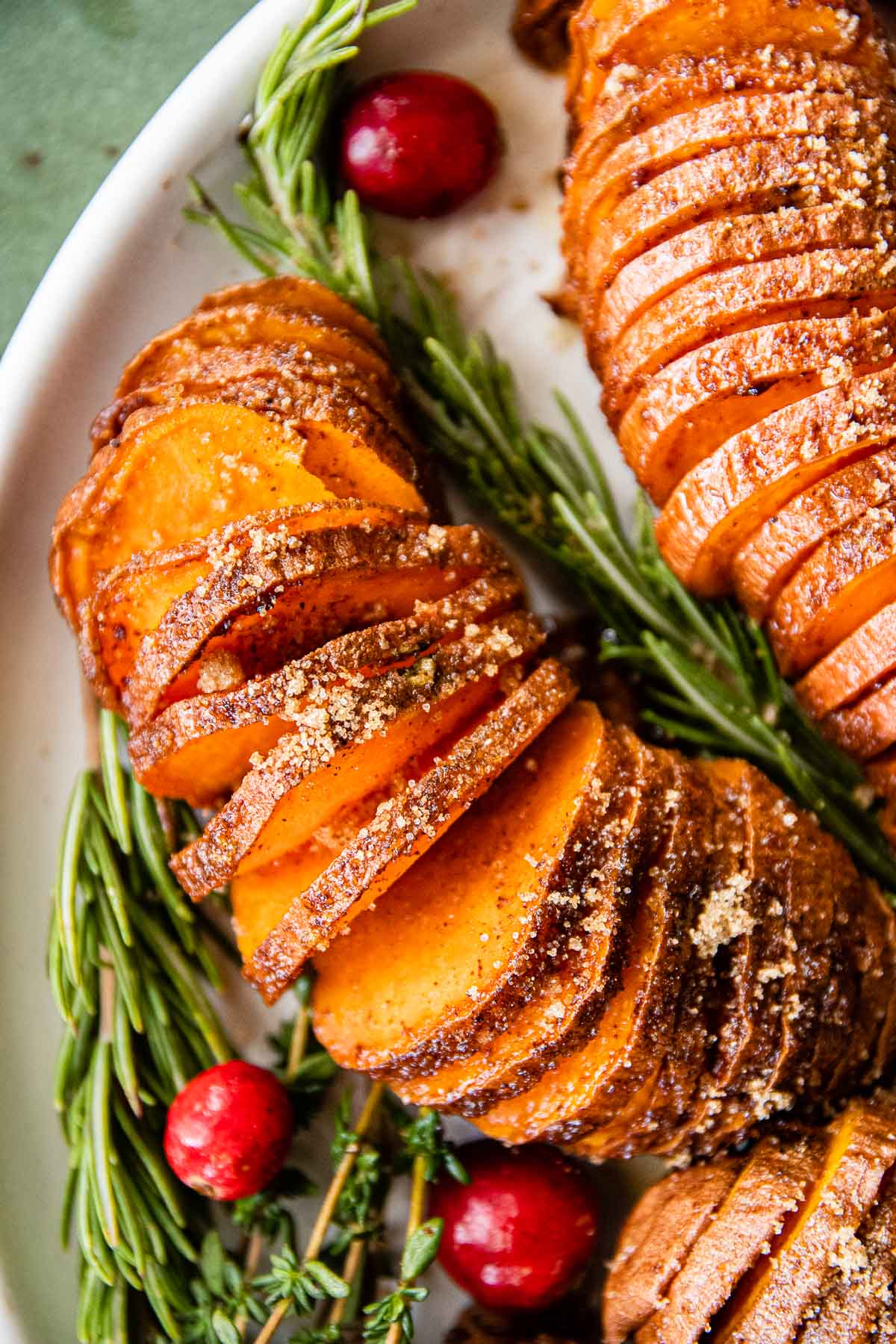 Candied Hasselback Sweet Potatoes on serving platter closeup