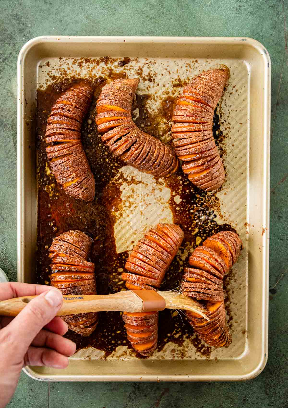 Candied Hasselback Sweet Potatoes second brushing with butter