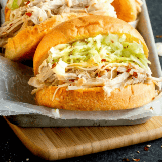 Close up of chicken on bun with veggies