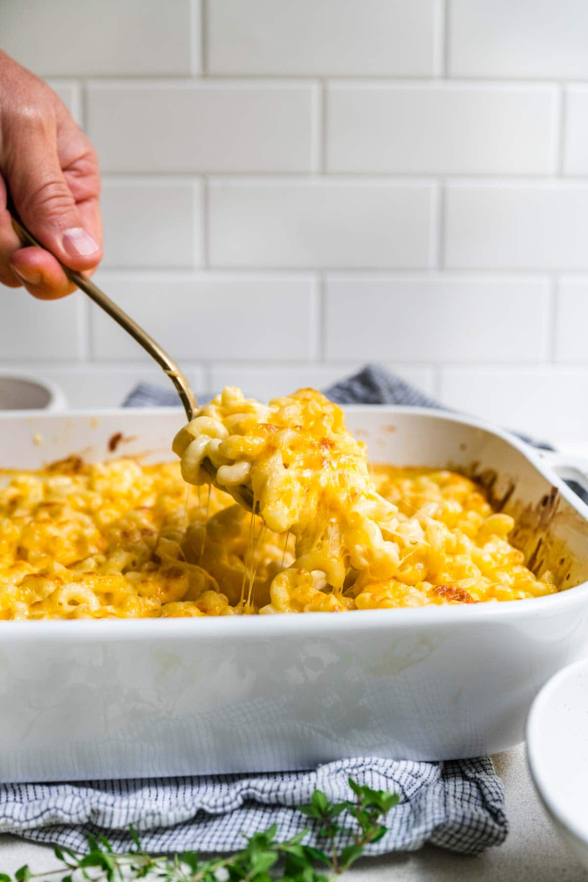 Chick-Fil-A Mac and Cheese being spooned from baking dish