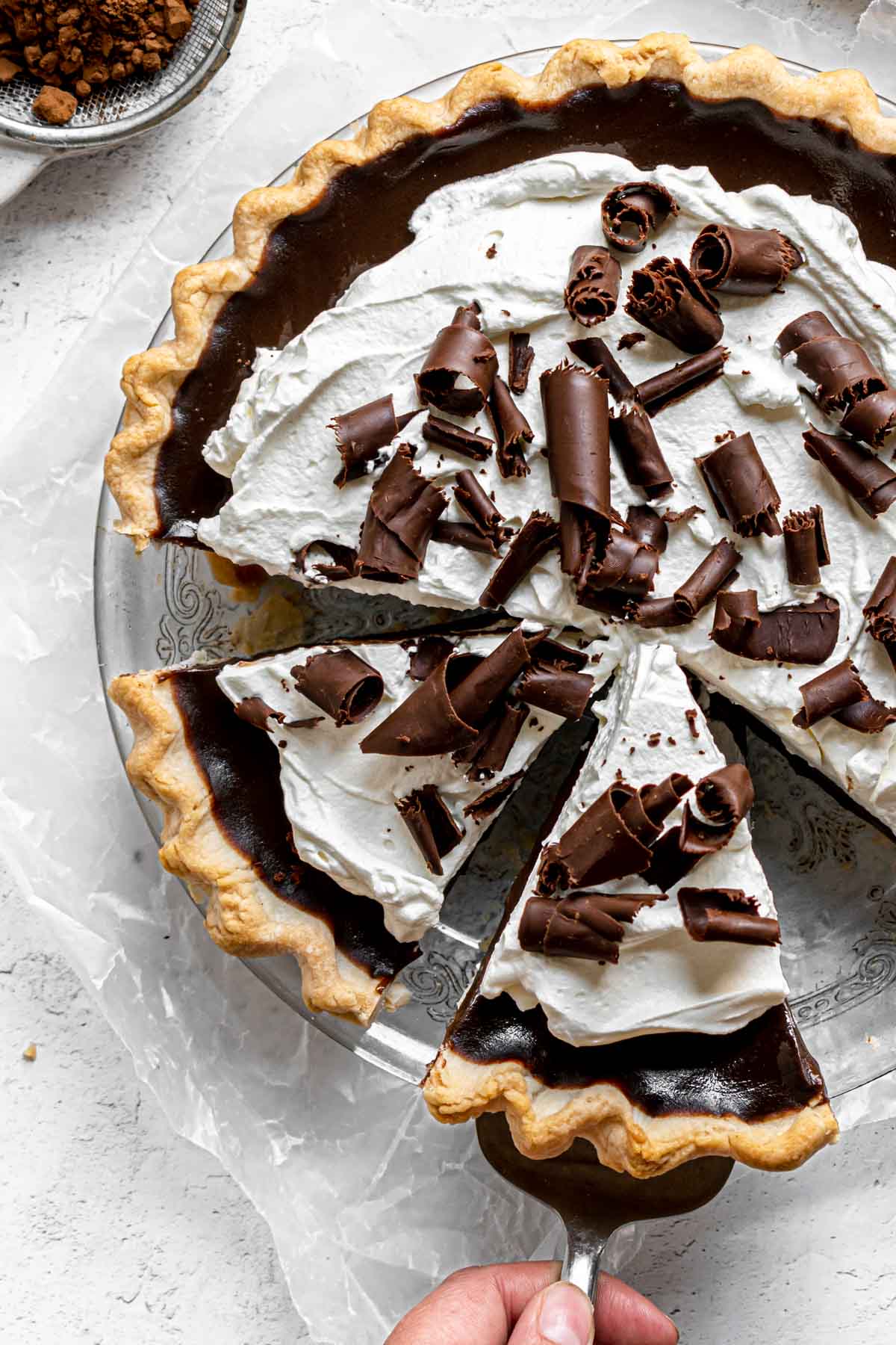 Chocolate Cream Pie with whipped cream and chocolate shavings in pie dish