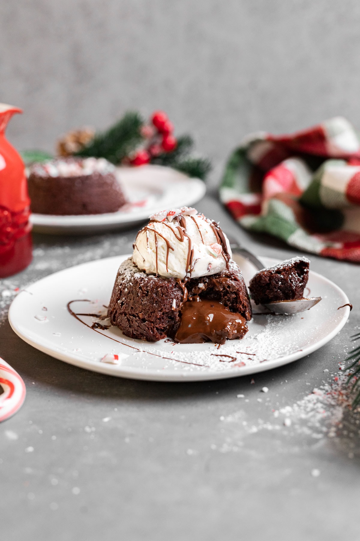 Chocolate Peppermint Lava Cakes served with vanilla ice cream on plate with spoon