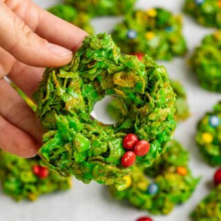 Hand holding up a Christmas Wreath Cookie