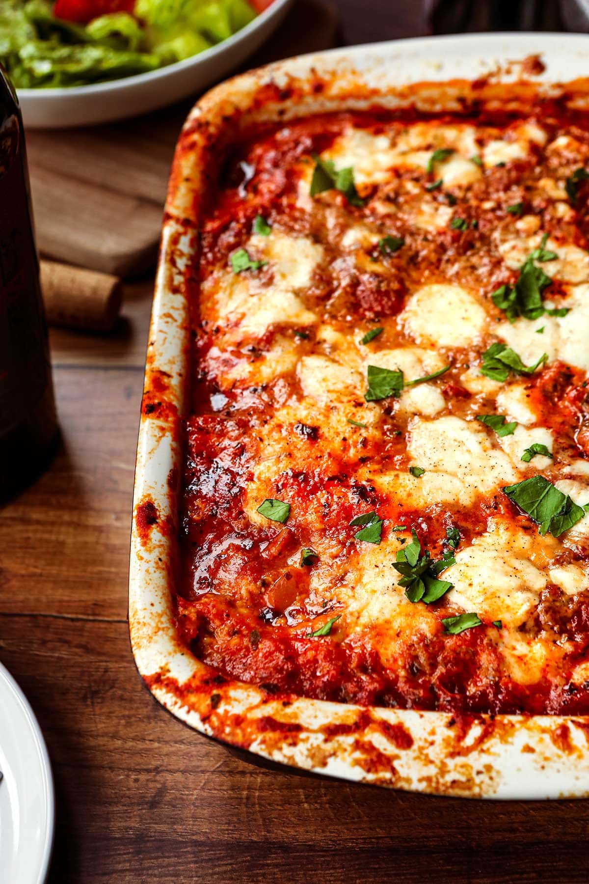 Eggplant Bake in baking dish with parsley garnish