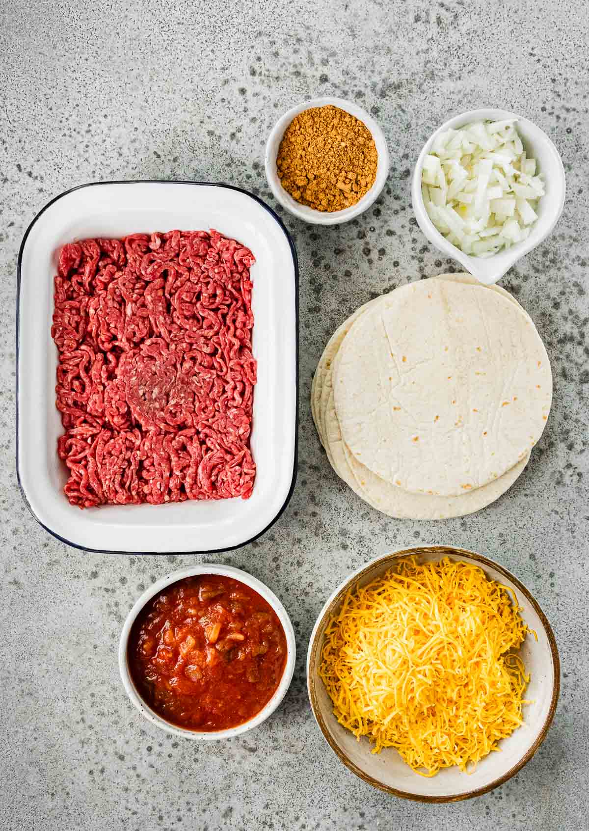 Ground Beef Soft Tacos ingredients spread out in separate prep bowls